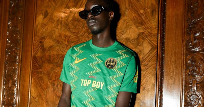 model wearing hackney wick fc 2023-24 home shirt in green